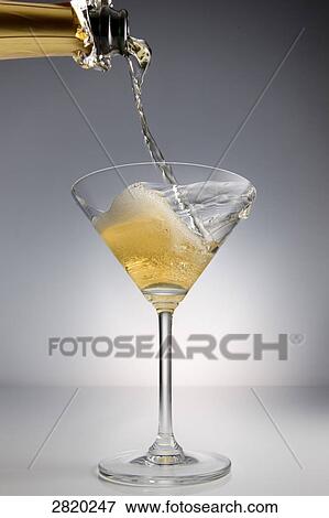 pouring champagne into a glass, close-up View Large Photo Image Stock Photo - pouring champagne into a glass, close-up . Fotosearch