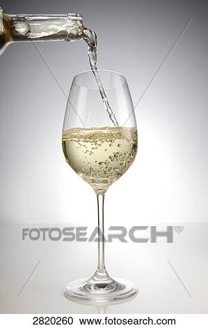 pouring white wine into a glass, close-up View Large Photo Image Stock Image - pouring white wine into a glass, close-up . Fotosearch