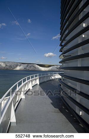 Stock Photo - Railing of ship with cliffs in background, Dover, Kent, England . Fotosearch