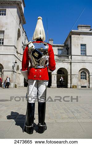 Rear view of guard standing in traditional uniform, London, England View Large Photo Image Stock Photography - Rear view of guard standing in traditional uniform, London, England . Fotosearch