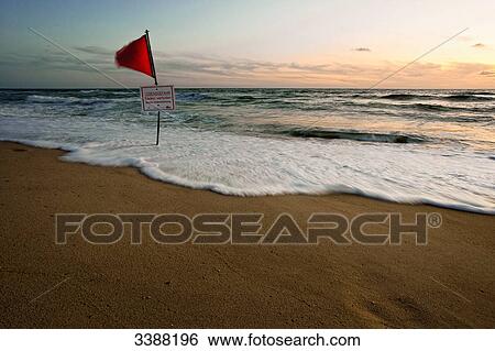 Red flag and danger sign at the North Sea coast, Sylt, Germany View Large Photo Image Stock Photograph - Red flag and danger sign at the North Sea coast, Sylt, Germany . Fotosearch