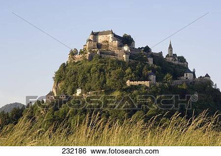 Reeds in field with castle on hill in background, Hochosterwitz Castle, Carinthia, Austria View Large Photo Image Stock Photograph - Reeds in field with castle on hill in background, Hochosterwitz Castle, Carinthia, Austria . Fotosearch