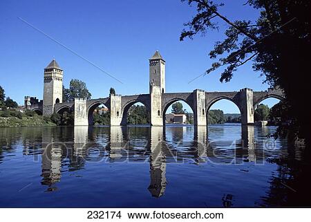 Picture - Reflection of bridge in water, Pont Valentre, Lot River, Perigord, Cahors, France . Fotosearch