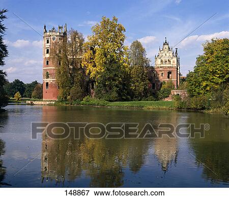 Reflection of castle and trees in water, Muskau Castle, Muskau, Saxony, Germany View Large Photo Image Stock Photo - Reflection of castle and trees in water, Muskau Castle, Muskau, Saxony, Germany . Fotosearch