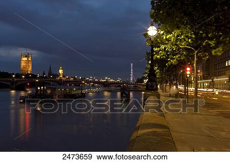 Stock Photo - River with government building in background, Thames River, Big Ben, Houses Of Parliament, City Of Westminster, London, England . Fotosearch