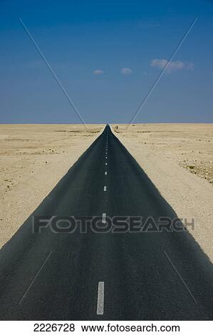 Stock Photo - Road passing through desert, Qatar . Fotosearch