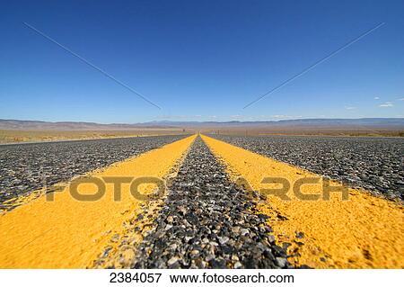 Road running through landscape, Nevada, USA View Large Photo Image Stock Photo - Road running through landscape, Nevada, USA . Fotosearch