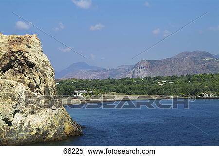 Rock formation in sea, Aeolian Islands, Sicily, Italy View Large Photo Image Stock Photography - Rock formation in sea, Aeolian Islands, Sicily, Italy . Fotosearch