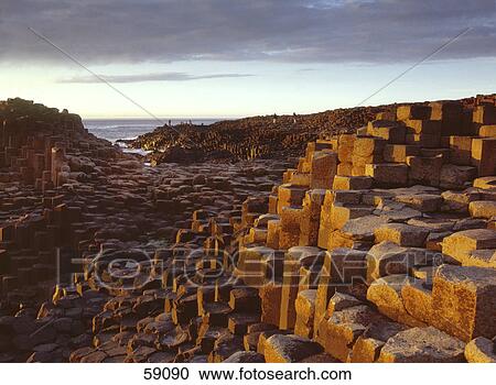 Stock Image - Rock formations on coast, Giants Causeway, County Antrim, Northern Ireland . Fotosearch
