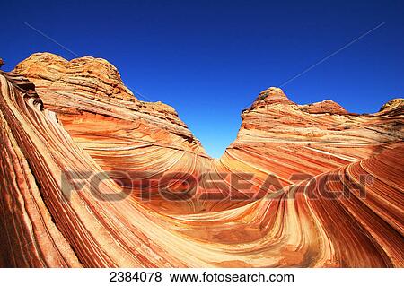 Stock Photo - Rock formations on landscape, Coyote Buttes, Arizona, USA . Fotosearch
