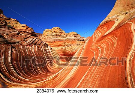 Stock Photograph - Rock formations on landscape, Coyote Buttes, Arizona, USA . Fotosearch