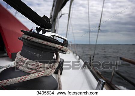 Rope tied-up on a winch of a sailboat, close-up View Large Photo Image Picture - Rope tied-up on a winch of a sailboat, close-up . Fotosearch