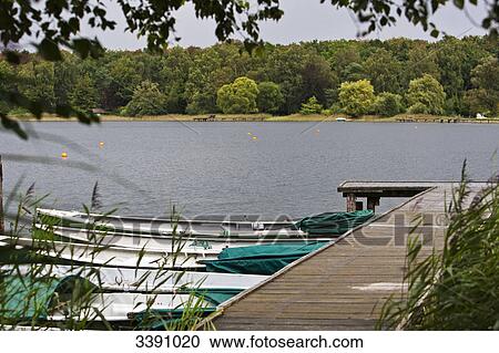 Rowing boats at Ihlsee, Schleswig-Holstein, Germany View Large Photo Image Stock Image - Rowing boats at Ihlsee, Schleswig-Holstein, Germany . Fotosearch