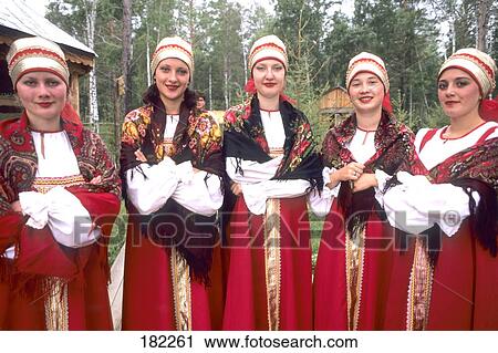 Stock Image - Russian women smiling in traditional clothing, Siberia, Russia . Fotosearch