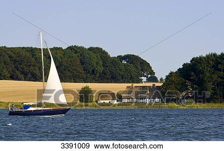 Sailing boat on Schlei, Schleswig-Holstein, Germany View Large Photo Image Stock Photo - Sailing boat on Schlei, Schleswig-Holstein, Germany . Fotosearch