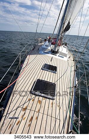 Stock Image - Sailing yacht on the baltic sea between Flensburg and Sonderburg, elevated view . Fotosearch