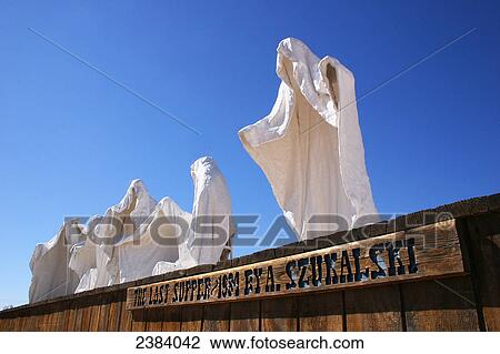 Stock Image - Sculptures of ghost on landscape, Goldwell Open Air Museum, Rhyolite, Nevada, USA . Fotosearch