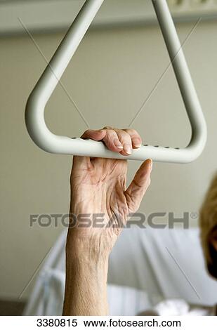 Stock Photography - Senior woman in hospital bed . Fotosearch