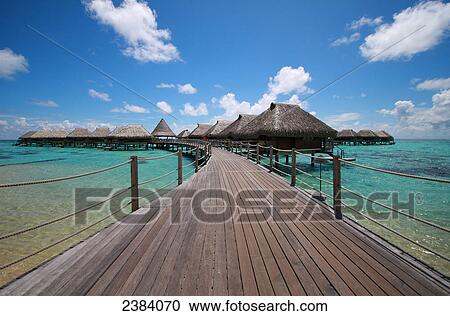 Stock Image - Shacks in shallow water, Manihi, Tuamotu Archipelago, French Polynesia, Polynesia, Pacific Island . Fotosearch