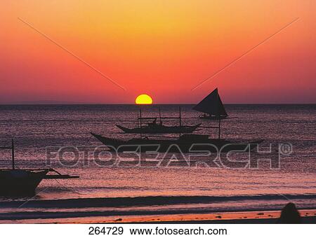 Silhouette of boats moored at beach, Boracay Beach, Philippines View Large Photo Image Stock Photo - Silhouette of boats moored at beach, Boracay Beach, Philippines . Fotosearch