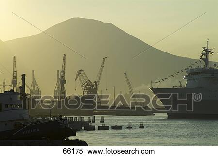 Silhouette of cranes and ships at harbor, Naples, Italy View Large Photo Image Stock Photography - Silhouette of cranes and ships at harbor, Naples, Italy . Fotosearch