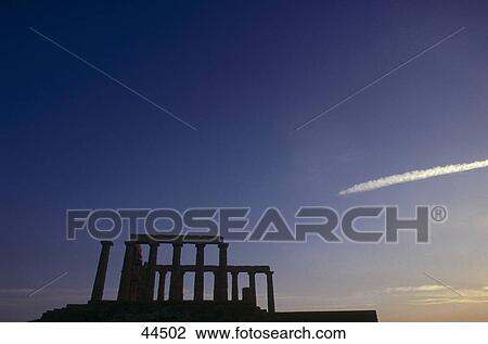 Stock Image - Silhouette of old ruins against blue sky, Cap Sunion, Greece . Fotosearch