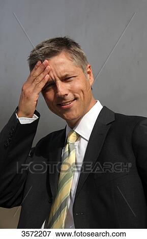 Stock Photo - Smiling businessman outdoors, portrait . Fotosearch
