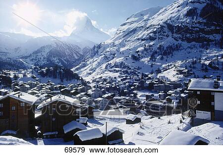 Snow covered houses in a village, Matterhorn, Switzerland View Large Photo Image Stock Photo - Snow covered houses in a village, Matterhorn, Switzerland . Fotosearch
