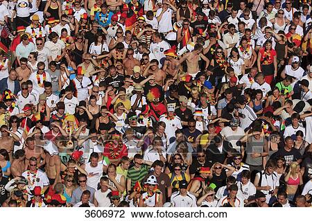 Soccer fans during 2010 FIFA World Cup on the Fanmeile Berlin, Germany View Large Photo Image Stock Image - Soccer fans during 2010 FIFA World Cup on the Fanmeile Berlin, Germany . Fotosearch