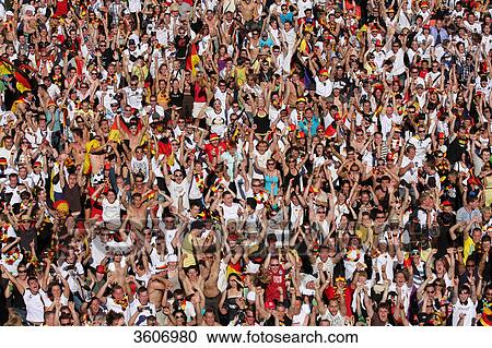 Stock Image - Soccer fans during 2010 FIFA World Cup on the Fanmeile Berlin, Germany . Fotosearch