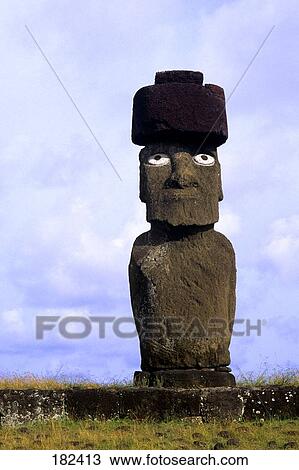 Stock Image - Statue in field, Moai Statue, Easter Island, Chile . Fotosearch