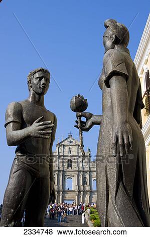Stock Photo - Statues with church in background, St. Paul's Church, Macau, Guangdong Province, China . Fotosearch
