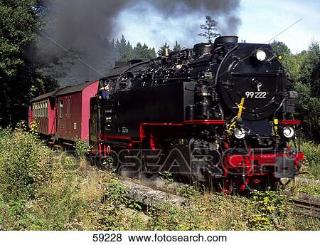 Stock Photo - Steam train on landscape, Saxony Anhalt, Germany . Fotosearch