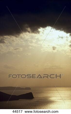 Stock Photo - Storm clouds over sea at dusk, Astepalea, Cyclades Islands, Greece . Fotosearch