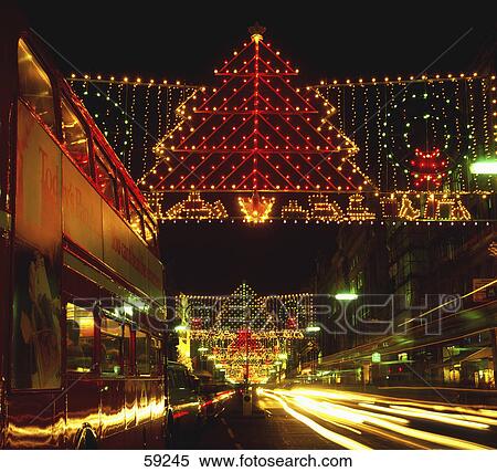 Stock Photography - Street illuminated with Christmas lights, London, England . Fotosearch