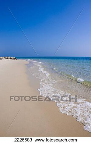 Stock Image - Surf on beach, Sealine Beach Resort, Mesaieed, Qatar . Fotosearch