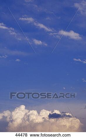 Thunder clouds in blue sky View Large Photo Image Stock Photo - Thunder clouds in blue sky . Fotosearch