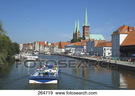 Tour boat sailing in river, Schleswig-Holstein, Germany View Large Photo Image Stock Photo - Tour boat sailing in river, Schleswig-Holstein, Germany . Fotosearch