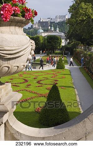 Stock Photograph - Tourists at garden of castle, Mirabell Gardens, Hohensalzburg Castle, Salzburg, Austria . Fotosearch