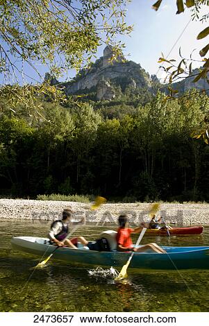 Stock Photo - Tourists canoeing in river, Gorges Du Tarn, France . Fotosearch