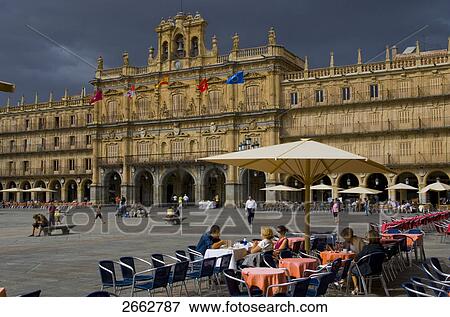 Stock Photo - Tourists enjoying at sidewalk cafe . Fotosearch
