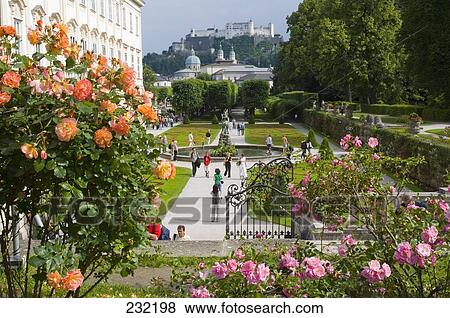 Stock Photo - Tourists in garden, Mirabell Gardens, Salzburg, Austria . Fotosearch