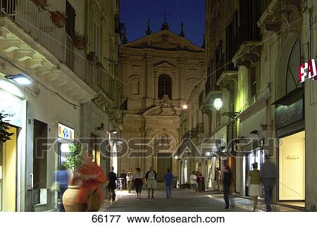 Stock Photo - Tourists near church at night, Basilica Di Santa Croce, Lecce, Apulia, Italy . Fotosearch