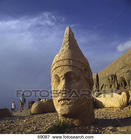 Tourists near old sculptures, Cappadocia, Anatolia, Turkey View Large Photo Image Stock Photo - Tourists near old sculptures, Cappadocia, Anatolia, Turkey . Fotosearch