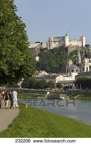 Tourists near river, Salzach River, Salzburg, Austria View Large Photo Image Stock Photograph - Tourists near river, Salzach River, Salzburg, Austria . Fotosearch