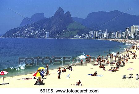 Tourists on beach, Copacabana Beach, Rio de Janeiro, Brazil View Large Photo Image Stock Photography - Tourists on beach, Copacabana Beach, Rio de Janeiro, Brazil . Fotosearch