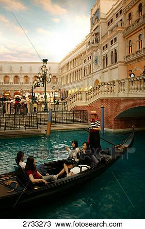 Tourists on gondola in canal, Venice, Veneto, Italy View Large Photo Image Stock Image - Tourists on gondola in canal, Venice, Veneto, Italy . Fotosearch
