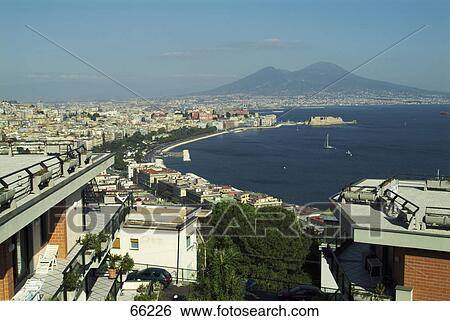 Town and volcano at waterfront, Mt Vesuvius, Naples, Campania, Italy  View Large Photo Image Stock Photograph - Town and volcano at waterfront, Mt Vesuvius, Naples, Campania, Italy . Fotosearch