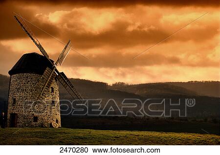 Traditional windmill at dusk View Large Photo Image Stock Image - Traditional windmill at dusk . Fotosearch