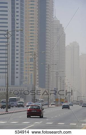 Traffic with skyscrapers at roadside, United Arab Emirates View Large Photo Image Picture - Traffic with skyscrapers at roadside, United Arab Emirates . Fotosearch